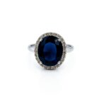 Midnight Royal Ring – Oval Blue Cubic Zirconia Halo Cocktail Ring