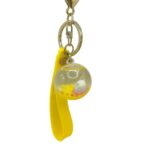 Bubble Orbit – Yellow UFO & Planet Capsule Keychain